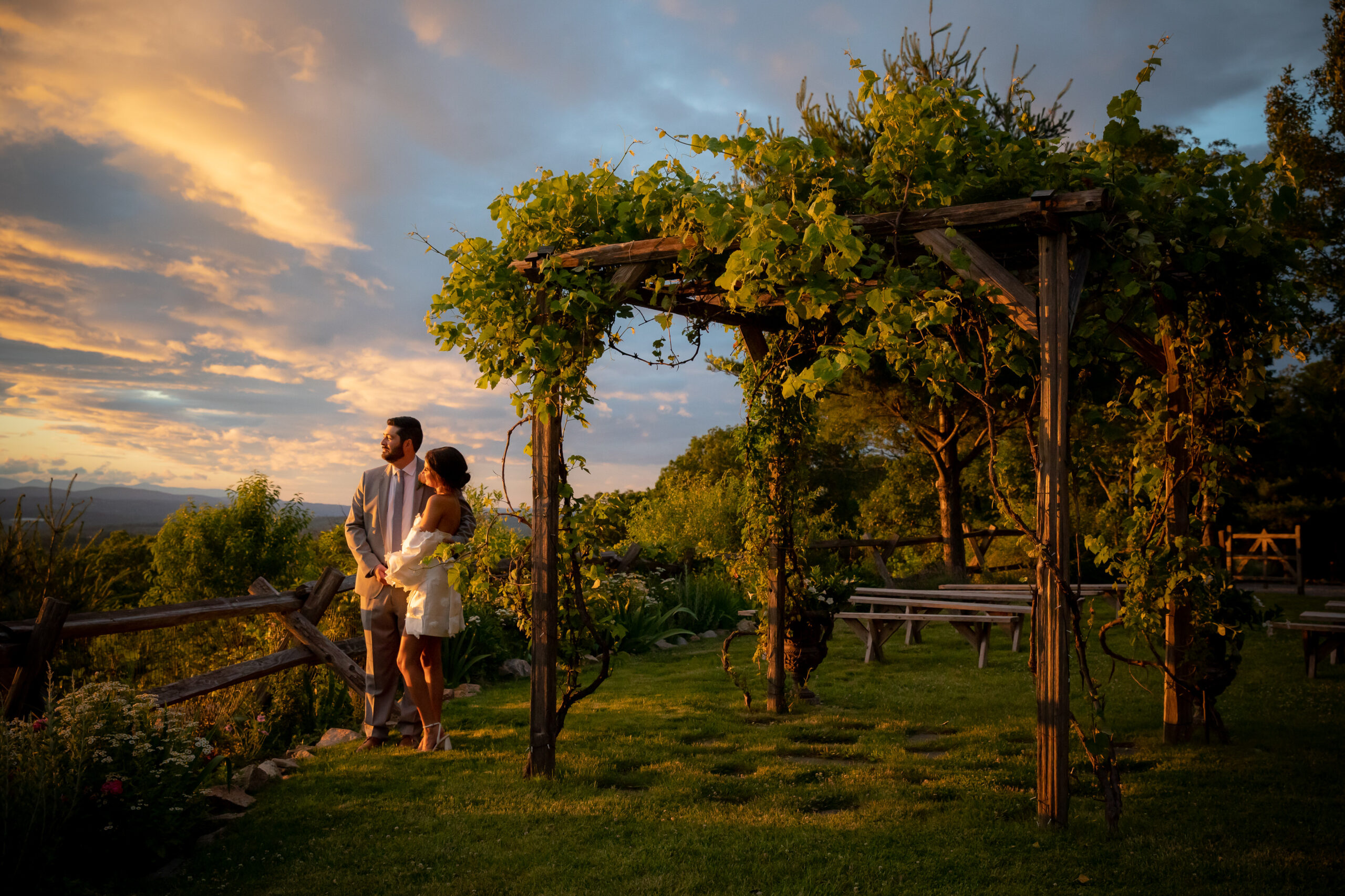 Lamb's Hill bride and groom admire sunset and enjoy wedding planning while overlooking the Hudson Valley.  