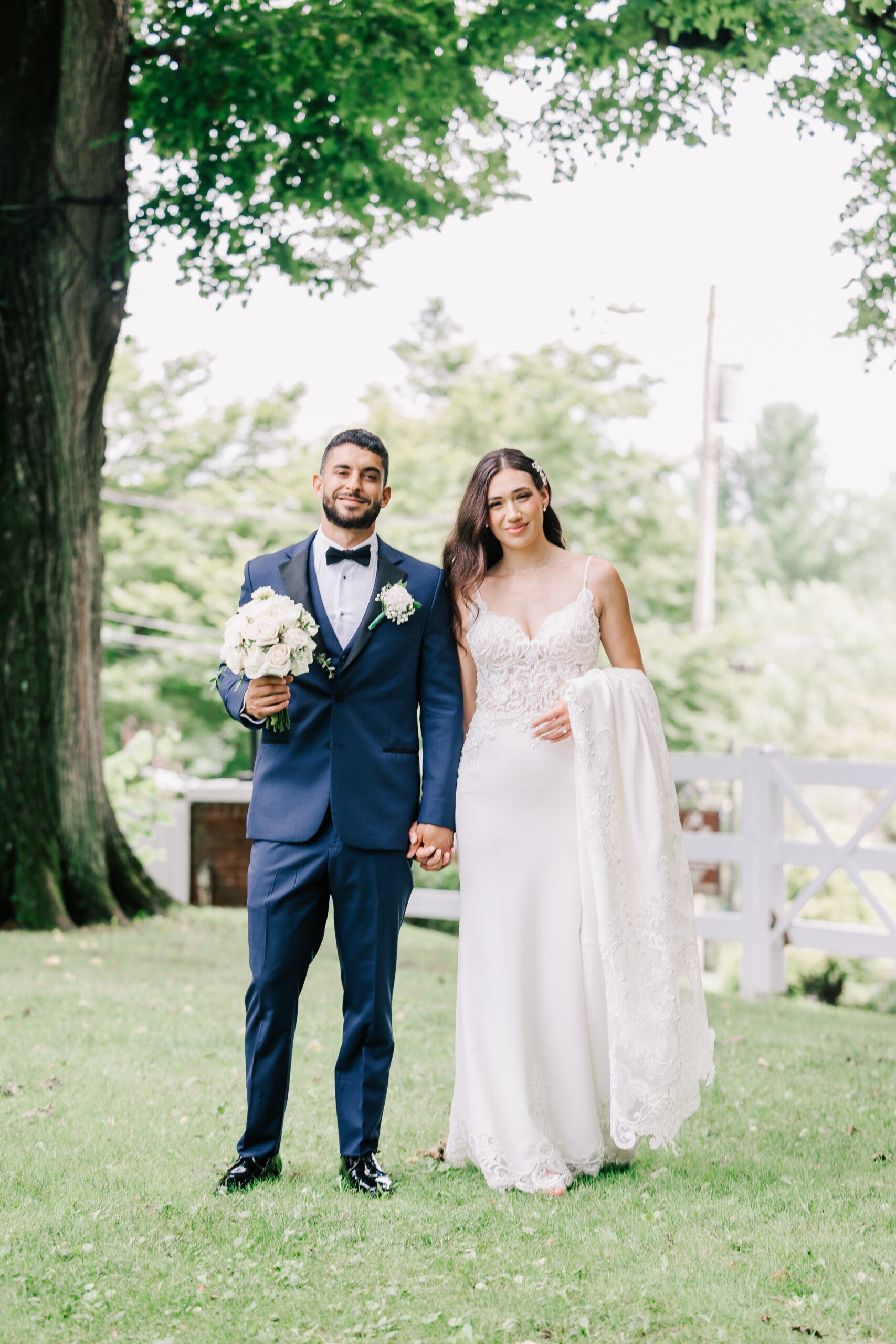 Bride and Groom walking the grounds of the Briarcliff Manor