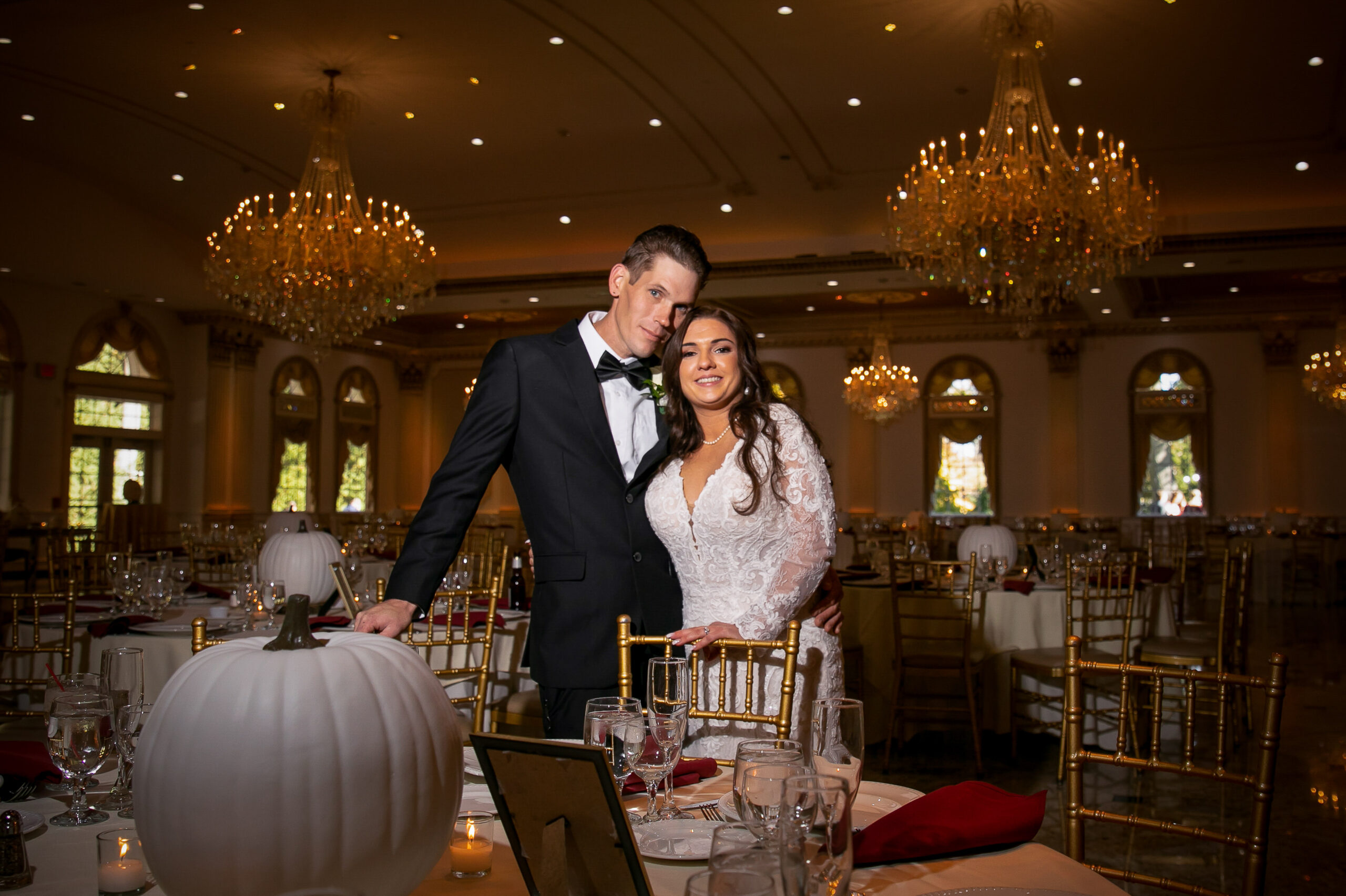 Bride and groom in ballroom.