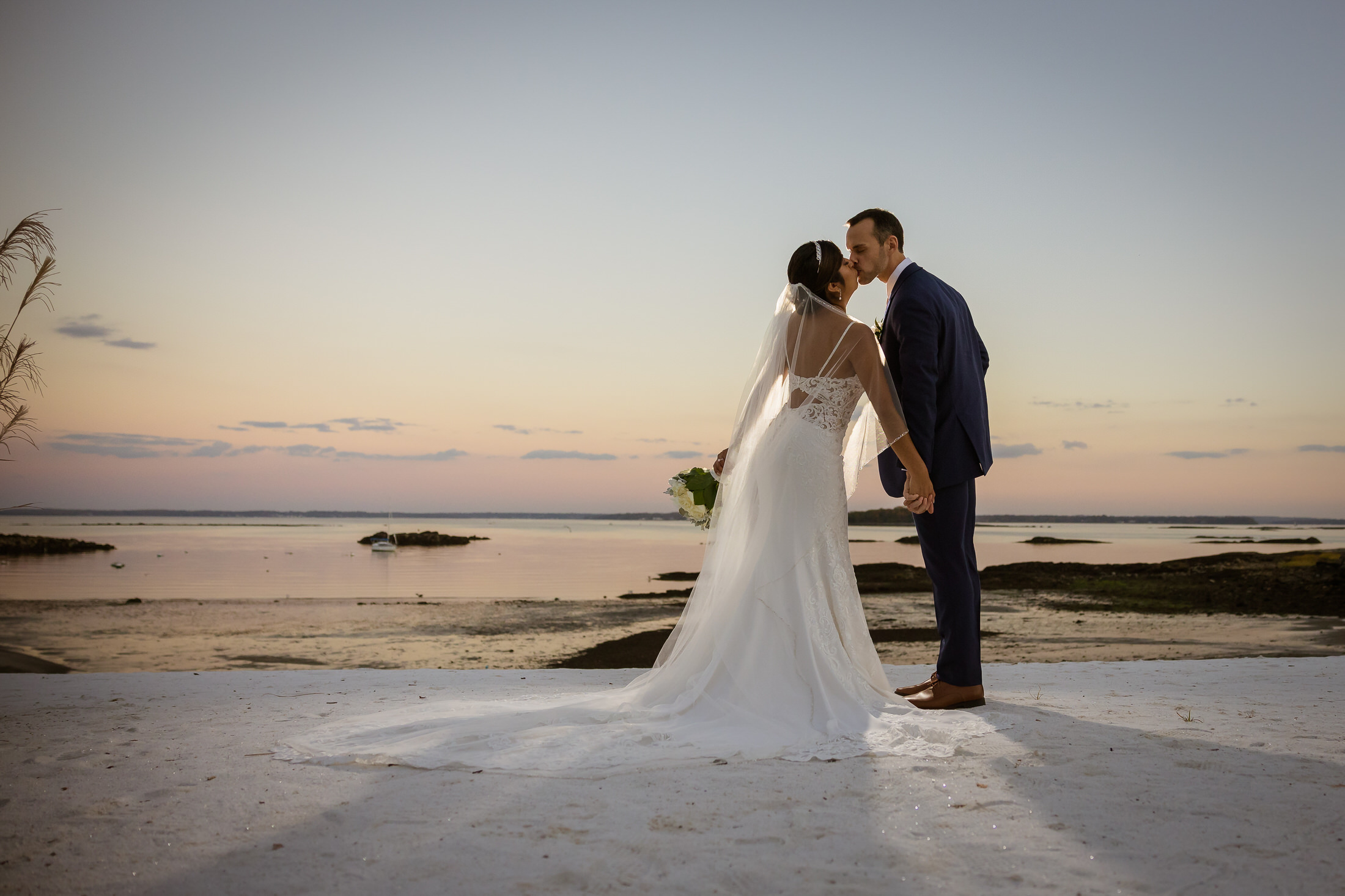 Bride and Groom on beach during sunset at The Surf Club on the Sound