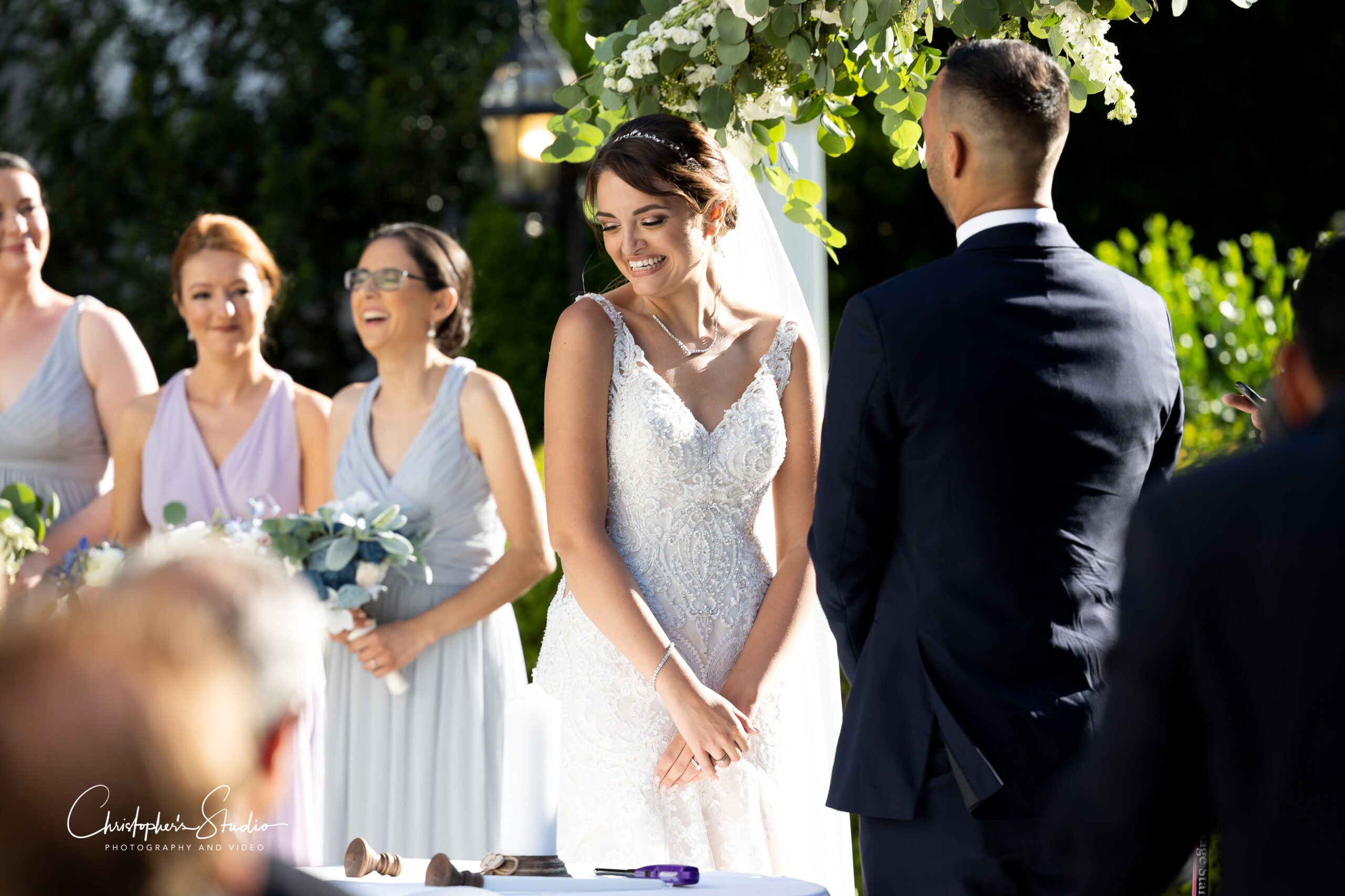 Bride blushing during wedding vows