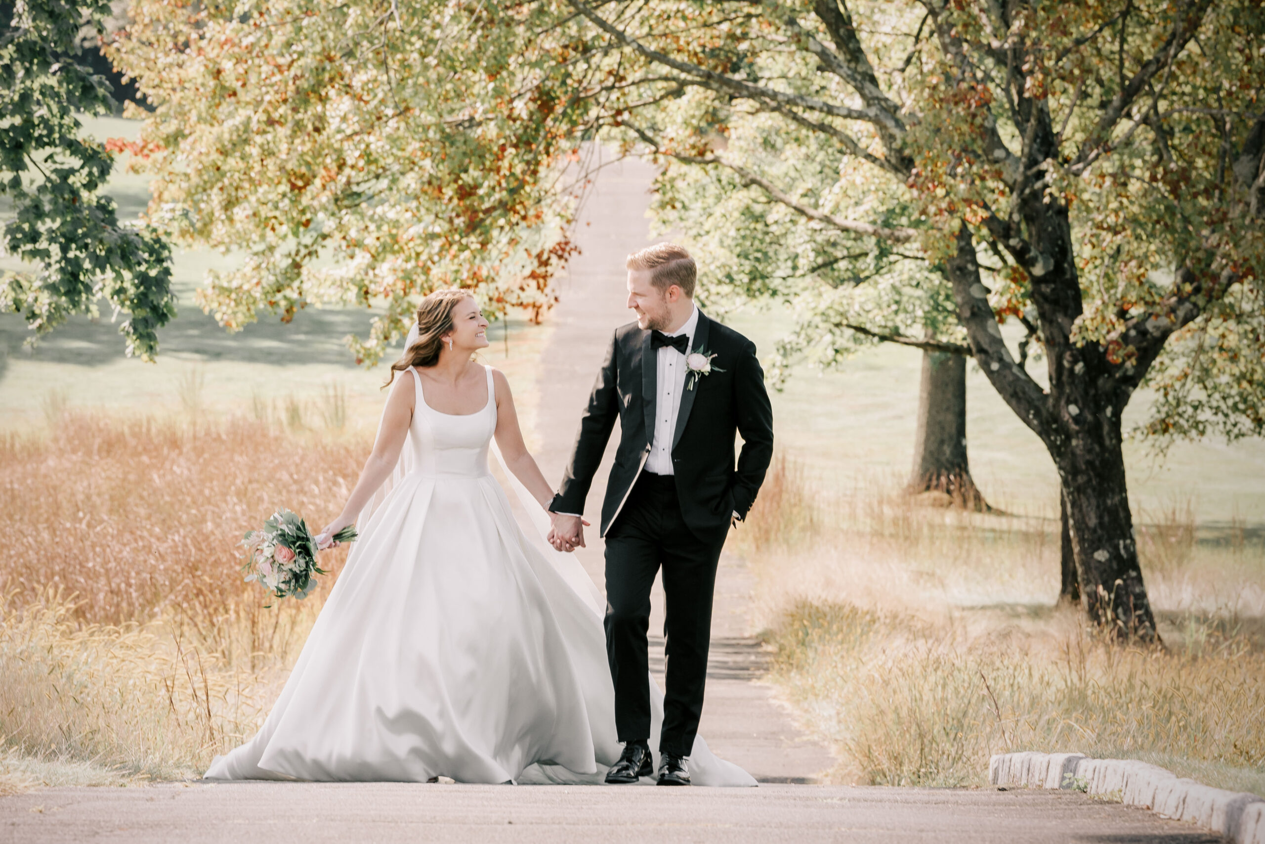 Bride and Groom walking in a park