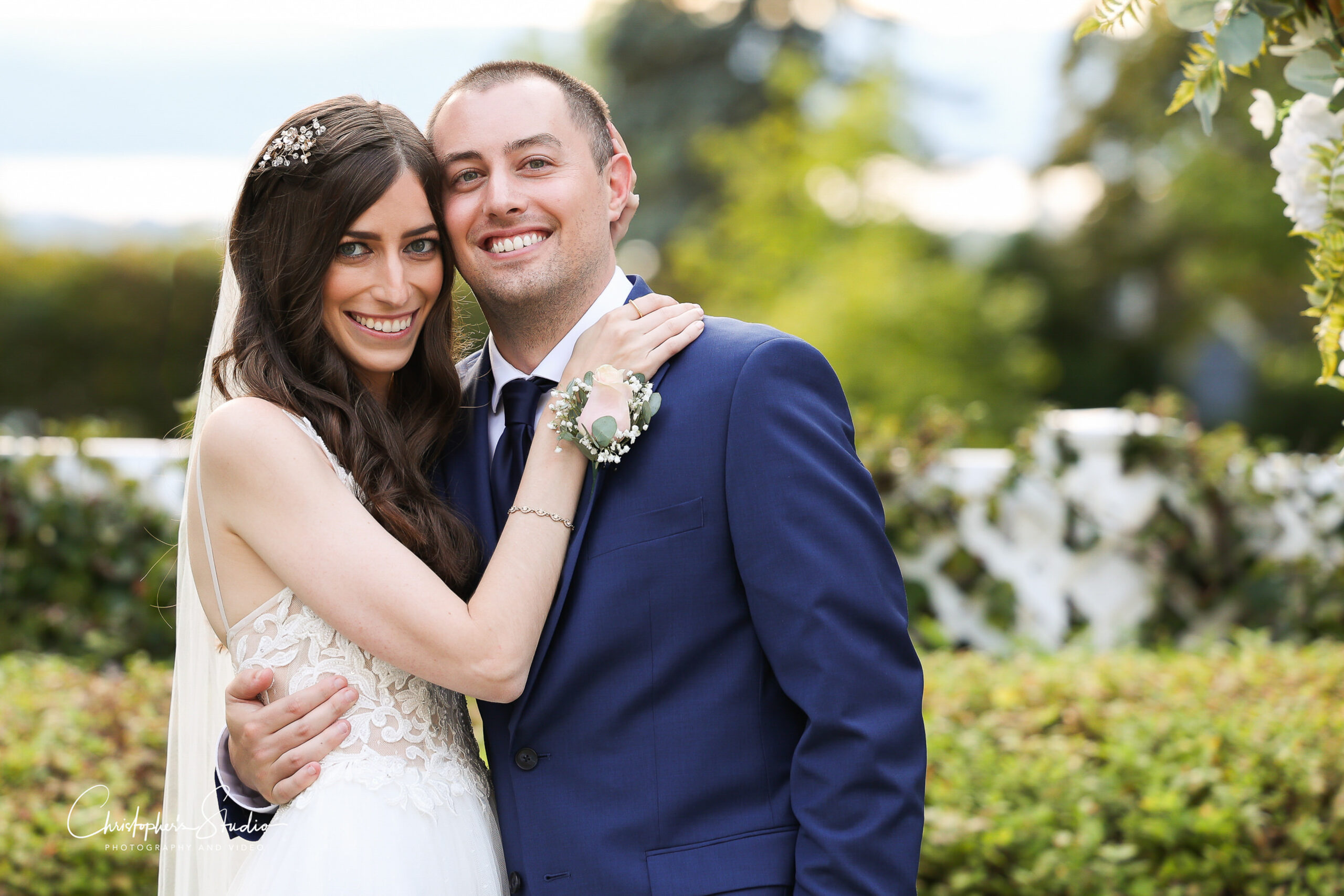 Bride and Groom smiling for photos at The Briarcliff Manor wedding venue.