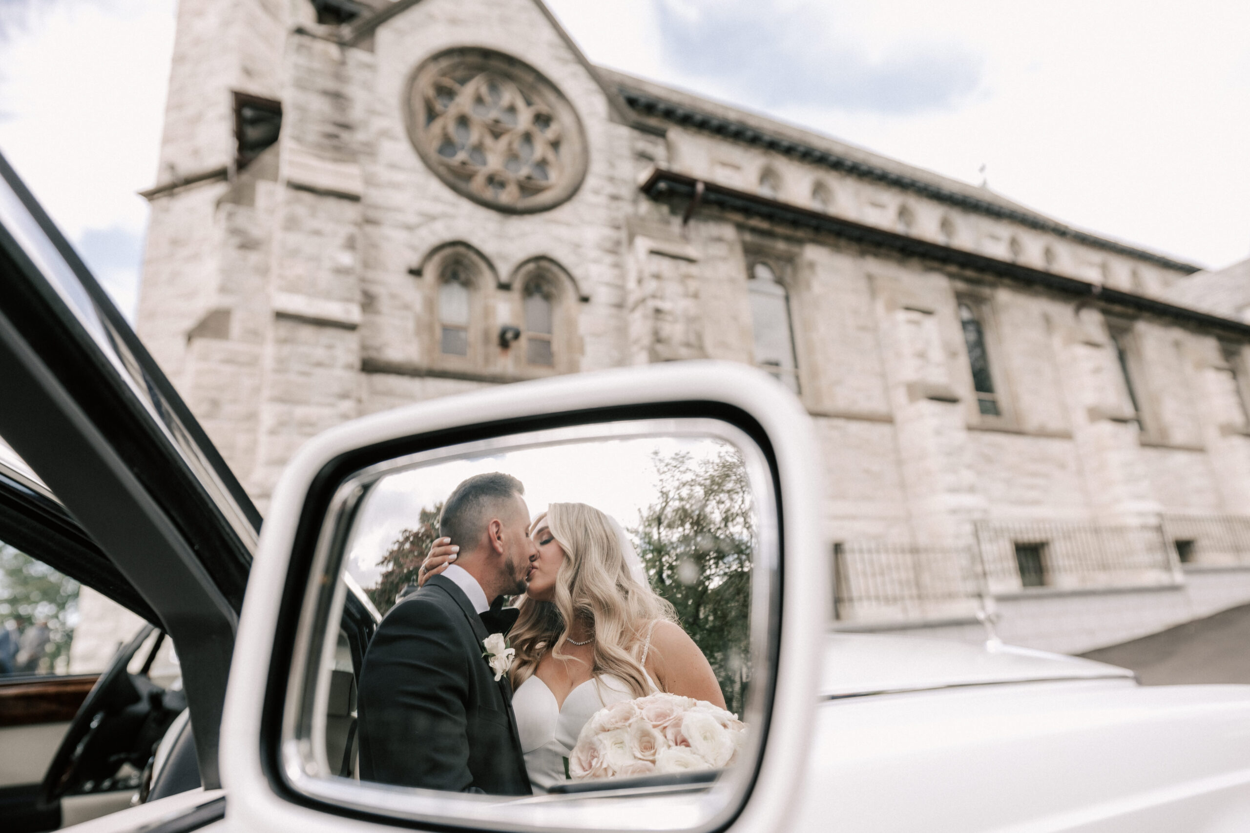 Bride and groom photo after the ceremony outside the church